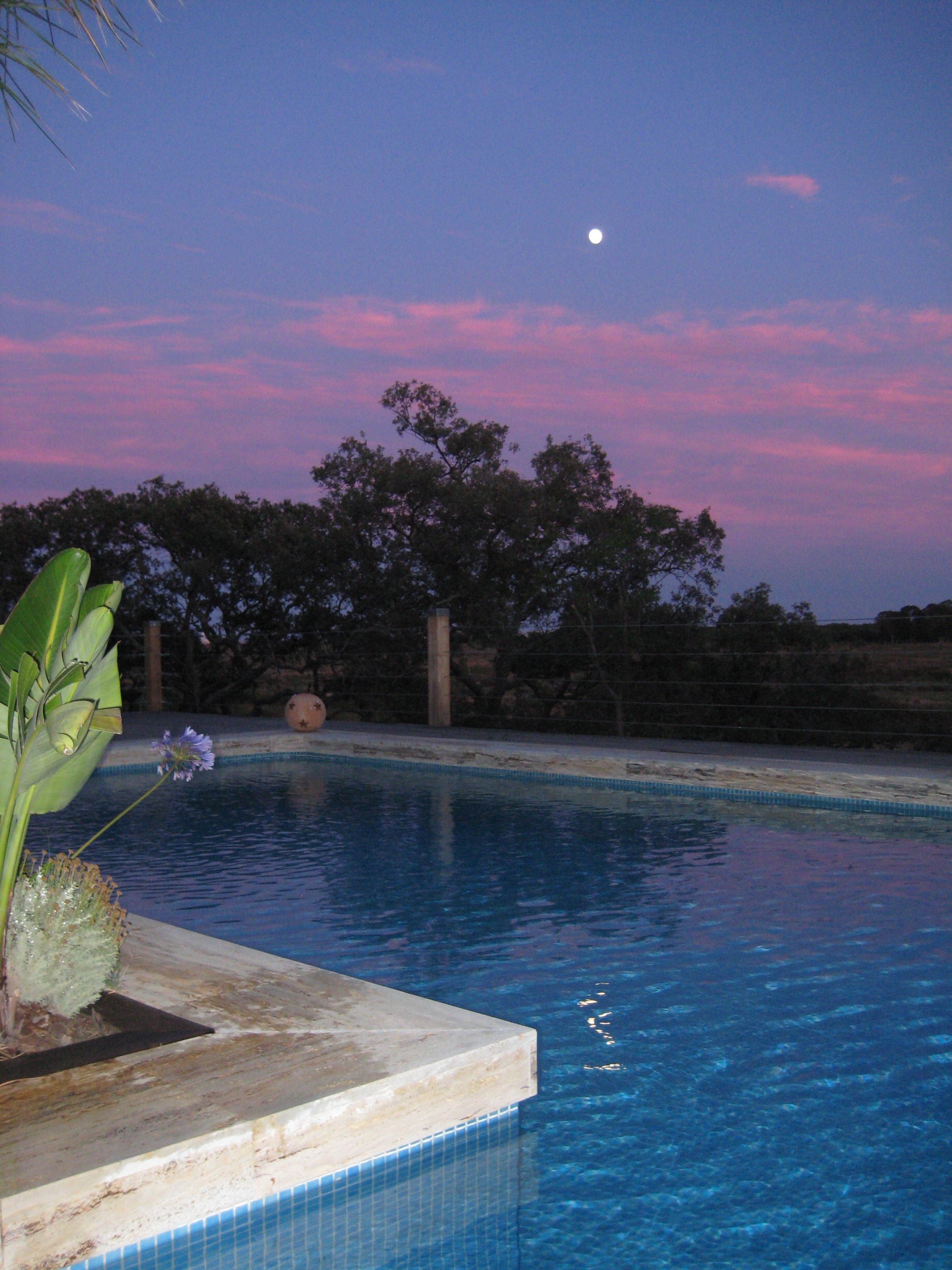 Sunset and full moon over the coast